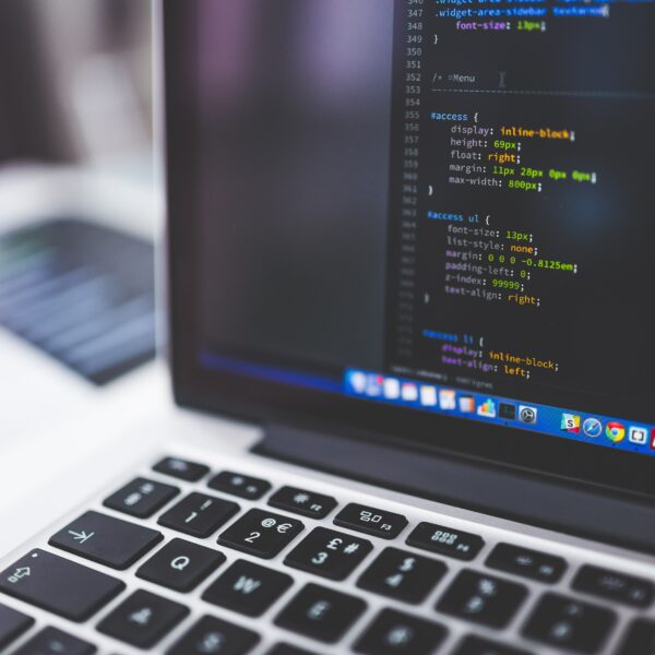 Developer laptop showing programming code