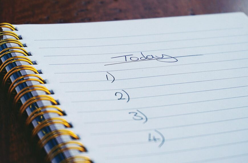 Notebook with pen on desk representing note-taking and information management for NotebookLM insights