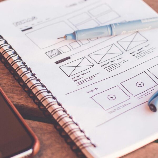 Organized workspace with notebook and planning materials representing modular thinking and productivity with Notion