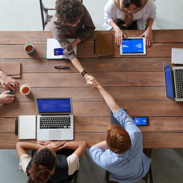 Project managers and Scrum masters using AI for team collaboration and ROI optimization