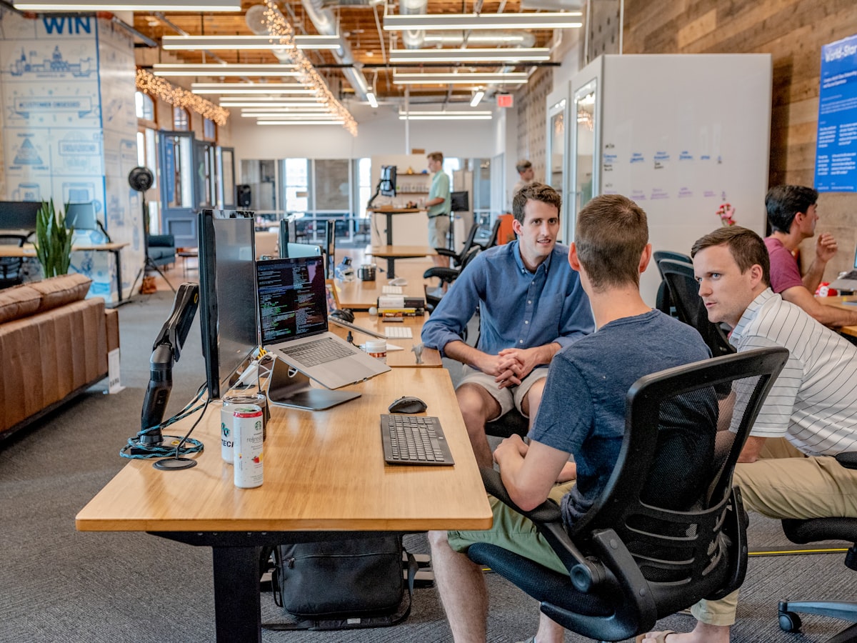 Scrum team meeting discussing sprint goals and backlog items